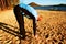 Silhouette of sport active adult man running and exercising on beach. Calm water, island and sunny sky