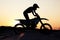 Silhouette, sports and motorcycle riding against sunset, sky and background in nature, extreme sport and adrenaline