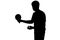 Silhouette of a sportsman getting ready to hit a ping pong ball