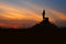 Silhouette Statue of buddha with sunset,Bethesda dark tone and sunset