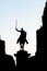 Silhouette of statue of a rider on a horse, holding a saber. Par