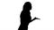 Silhouette Stressed businesswoman with mobile phone making a call.