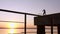 Silhouette Of A Strong Man Boxing Athlete On The Pier