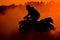 Silhouette summer offroad adventure on atv in sand