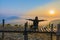 Silhouette the sunrise with a wooden skywalk, the fog, the beautiful sky and cloud at Phu Lam Duan Mountain, Pak Chom District,