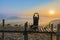 Silhouette the sunrise with a wooden skywalk, the fog, the beautiful sky and cloud at Phu Lam Duan Mountain, Pak Chom District,