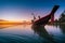 Silhouette of sunset time with fishing Long tail boats Traditional boats on the sea at Wok tum beach Phangan island,