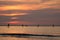 Silhouette of surf boys in the evening sun