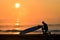 Silhouette Surfer on a misty beach with an amazing sunrise in Japan, Chiba, Katsuura