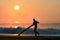 Silhouette Surfer on a misty beach with an amazing sunrise in Japan, Chiba, Katsuura