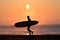 Silhouette Surfer on a misty beach with an amazing sunrise in Japan, Chiba, Katsuura