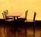 Silhouette table and chair in cafe at sunset