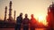 Silhouette of Teams engineer and foreman working at petrochemical oil refinery in sunset