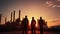 Silhouette of Teams engineer and foreman working at petrochemical oil refinery in sunset