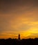 Silhouette technique under golden twilight evening sky with Walking Buddha statue in Thailand