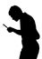 Silhouette of teenage boy investigating with a magnifying glass