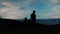 Silhouette of a teenage boy looking at Taal lake with his friends