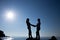 Silhouette of teenager couple on the beach