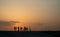 Silhouette of teenagers with their E-bikes during sunset