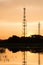 Silhouette telecommunications towers on sunrise