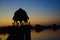 Silhouette of Temple on the Gadi Sagar lake With Four People