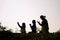 Silhouette of three woman kneeling down praying for worship God at white background. Christians pray to jesus christ for calmness