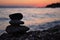 Silhouette of three zen rocks on the beach