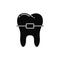 Silhouette of tooth with brace. Symbol for dentistry logo. Black and white illustration. Cutout hand drawn isolated vector image