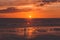 Silhouette of a tourist with a camera on a awesome sunset. Blackpool Central Pier, Lancashire, UK