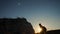 Silhouette tourist climber climbs a mountain. walking tourist hiking adventure climbers sunset climb the mountain . slow