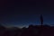 Silhouette of a tourist in the French Alps in the night