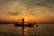 Silhouette of traditional fishermen throwing net fishing inle lake at sunrise time
