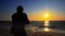 Silhouette of traditional fishermens pulling net fishing at ocean