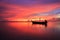 Silhouette traditional longtail boat and beautiful red sky and s