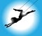 Silhouette of trapeze artist