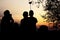 Silhouette of travelers enjoy their moment watching sunset