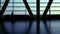 Silhouette of travelers passengers in airport transit terminal walking with luggage baggage going traveling