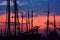 silhouette of trawlers mast and rigging against twilight sky