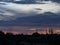 Silhouette of trees during Arizona Monsoon season with sunset view in the background