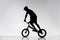 silhouette of trial cyclist balancing on bicycle