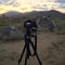 Silhouette tripod and camera. on the Mountain and solar