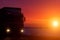 Silhouette Truck with container on highway, cargo transportation concept. Sunset background with copy space
