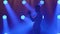 Silhouette of a trumpet player performance on stage with blue spotlights. Trumpet in hands close up. Side view. Slow