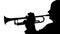 Silhouette trumpeter playing a slow tune on a pipe