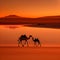 Silhouette of two camels in a desert