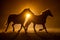 Silhouette of two galloping Haflinger Horses in a orange smokey atmosphere looking like a Rembrandt Painting