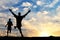 Silhouette of two men running competition