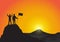 Silhouette of two men on top of mountain with fists raised up and holding flag, success, achievement,victory and winning concept