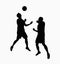 Silhouette of two soccer players fighting for ball.