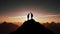 Silhouette of two travelers or hikers standing together on the top of mountain with a dusk sky and enjoys the moment of successful